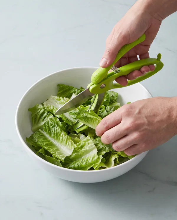 Chopping salad in a bowl with V TOWER salad scissors